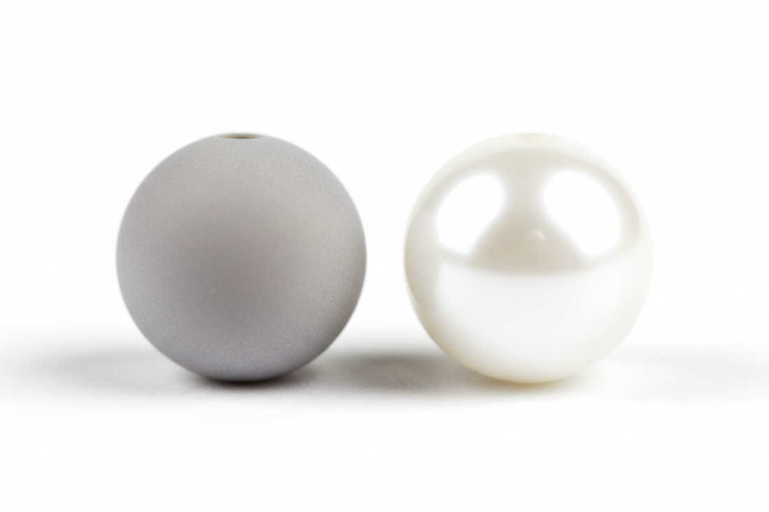 Side-by-side comparison of two bead types with subtle differences in texture and shine, soft lighting, clean minimal layout