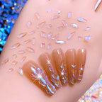 400Pcs Aurora Nail Art Rhinestones Mixed Shape Resin Crystal Nail Charms Iridescent Shapes Clear Nude Flatback Nail Art Charm Rhombus Heart Flower Butterfly Nail Diamonds for 3D DIY Nails Art Crafts - color: Transparent