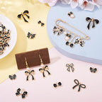Craftdady Enamel Dangle Charms Pendant Food Animal Flower Cute Charms Colorful Metal Fruit Pendants Hang Ornament for Craft Bracelet Necklace Earring Key Chains Jewelry Making - color: Black Bowknot
