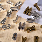 stino Metal Charms for Jewelry Making 100gram, Bulk Tibetan Silver & Gold Plated Trinkets for Earring Necklace Jewelry Making and Findings - color: Alphabet Silver & Gold Bronz
