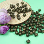 TOAOB 100pcs 8mm Antique Bronze Filigree Hollow Ball Beads Round Metal Loose Spacer Beads for DIY Crafts Bracelets Necklaces Earrings Jewelry Making - color: Antique bronze, size: 8mm