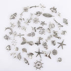 CHuangQi 100pcs Bulk Lots Jewelry Making Charms, Mixed Smooth Metal Charms, Pendants Bracelet Necklace Jewelry Making and DIY Craft Accessories - color: Silver