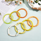 Ornaland 7Pcs Handmade Polymer Clay Heishi Surfer Stretch Bracelets Set Colorful Glass Beads Bracelets Boho Stackable Preppy Bracelets Wrist Jewelry for Women - color: Yellow