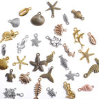stino 100g Metal Pendant Charms for Jewelry Making, Bulk Silver & Gold Plated Charms for Braclet Necklace Crafts, Animal Plant Flower Pet and so on - color: Sea Life Silver & Gold