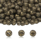 TOAOB 100pcs 6mm Antique Bronze Filigree Hollow Ball Beads Round Metal Loose Spacer Beads for DIY Crafts Bracelets Necklaces Earrings Jewelry Making - color: Antique bronze, size: 6mm