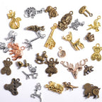 stino 100g Metal Pendant Charms for Jewelry Making, Bulk Silver & Gold Plated Charms for Braclet Necklace Crafts, Animal Plant Flower Pet and so on - color: Terricole Bronze Glod