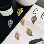 JIALEEY 210PCS Hollow Filigree Leaves Charms Pendants Craft Supplies for Necklace Bracelet Jewelry Making, Mixed 6 Color