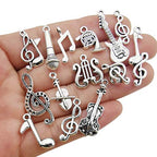 Youdiyla 70pcs Musical Symbol Charms Collection, BULK Music Notes Elements Guitar Violin Microphon Tape Horn Charms Metal Pendant Craft Supplies Findings for Jewelry Making-Silver HM211 - color: Silver Music Charms-70pcs