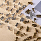 stino Metal Charms for Jewelry Making 100gram, Bulk Tibetan Silver & Gold Plated Trinkets for Earring Necklace Jewelry Making and Findings - color: Alphabet Silver & Gold Bronz