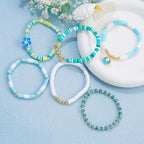 RISHEGAE Heishi Beaded Stretch Bracelets for Women Stackable Polymer Clay Beads Bracelets Friendship Boho Summer Beach Bracelet Jewelry Set - color: F-Blue Flower