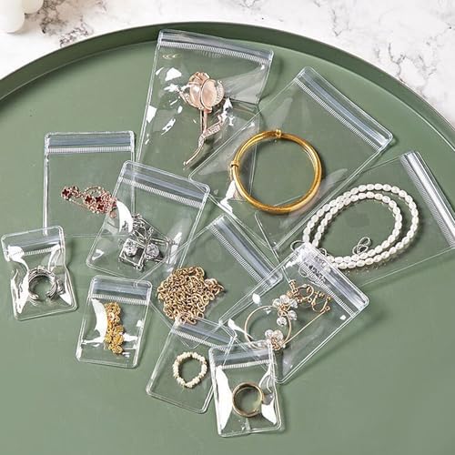 Swpeet 50Pcs 2.75"×3.93" Thick Clear PVC Jewelry Bags, Self Adhesive Portable Travel Jewelry Organizer, Plastic Jewelry Storage Bags, Transparent zipper bags, Anti Tarnish Lock Pouch for Rings - style: 7×10CM