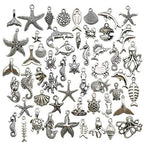 Youdiyla 100pcs Summer Beach Charms Collection, Bulk Marine Sea Animal Life Nautical Charms Metal Pendant Craft Supplies Findings for Necklace and Bracelet Jewelry Making (HM292) - color: Summer Beach Charm-100pcs
